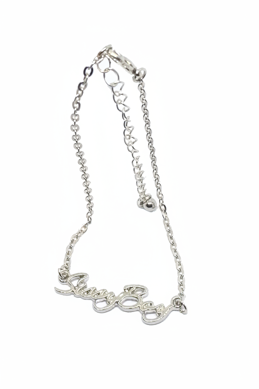 A silver-colored chain bracelet with a decorative script design.