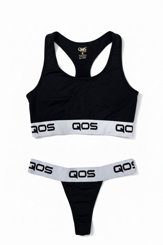 This image features a stylish and comfortable two-piece sports bralette set from the Queen of Spades (QOS) line. The set includes a sleek black sports bra adorned with the white QOS logo on both the front and back, enhancing its chic appeal.
