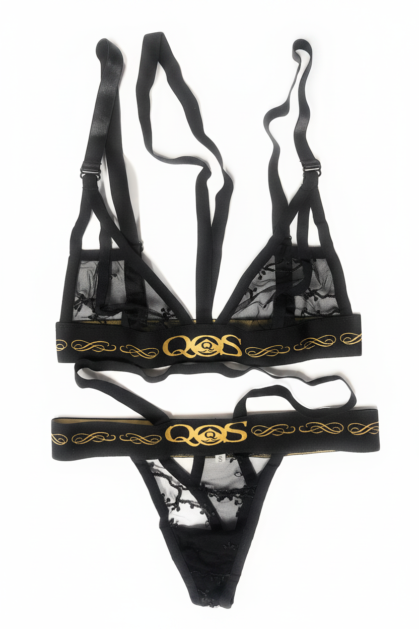 Black lace lingerie set featuring a strappy triangle bralette and matching thong, both with gold decorative trim and a prominent interlocking 'QS' logo on the waistband, displayed against a solid white background.
