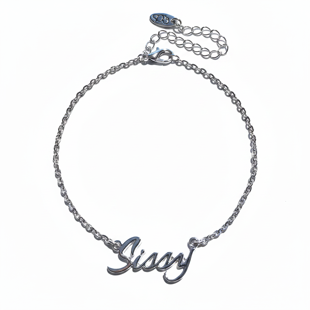 A silver-colored chain anklet with a cursive 'sissy' emblem on a closed chain design.