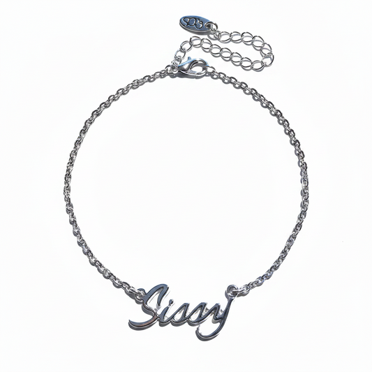 A silver-colored chain anklet with a cursive 'sissy' emblem on a closed chain design.