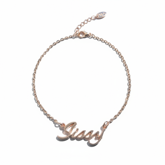 Rose gold chain anklet with the word 'Sissy' inscribed on it, displayed against a white background.
