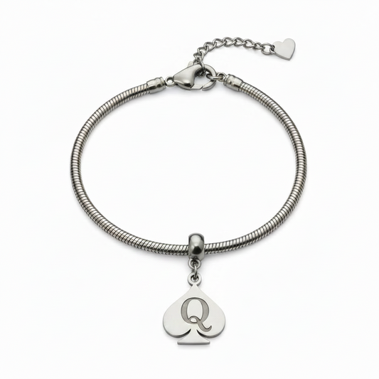 A silver snake chain bracelet featuring a heart-shaped charm engraved with the letter 'Q' and a small heart charm, displayed on a clean white background.
