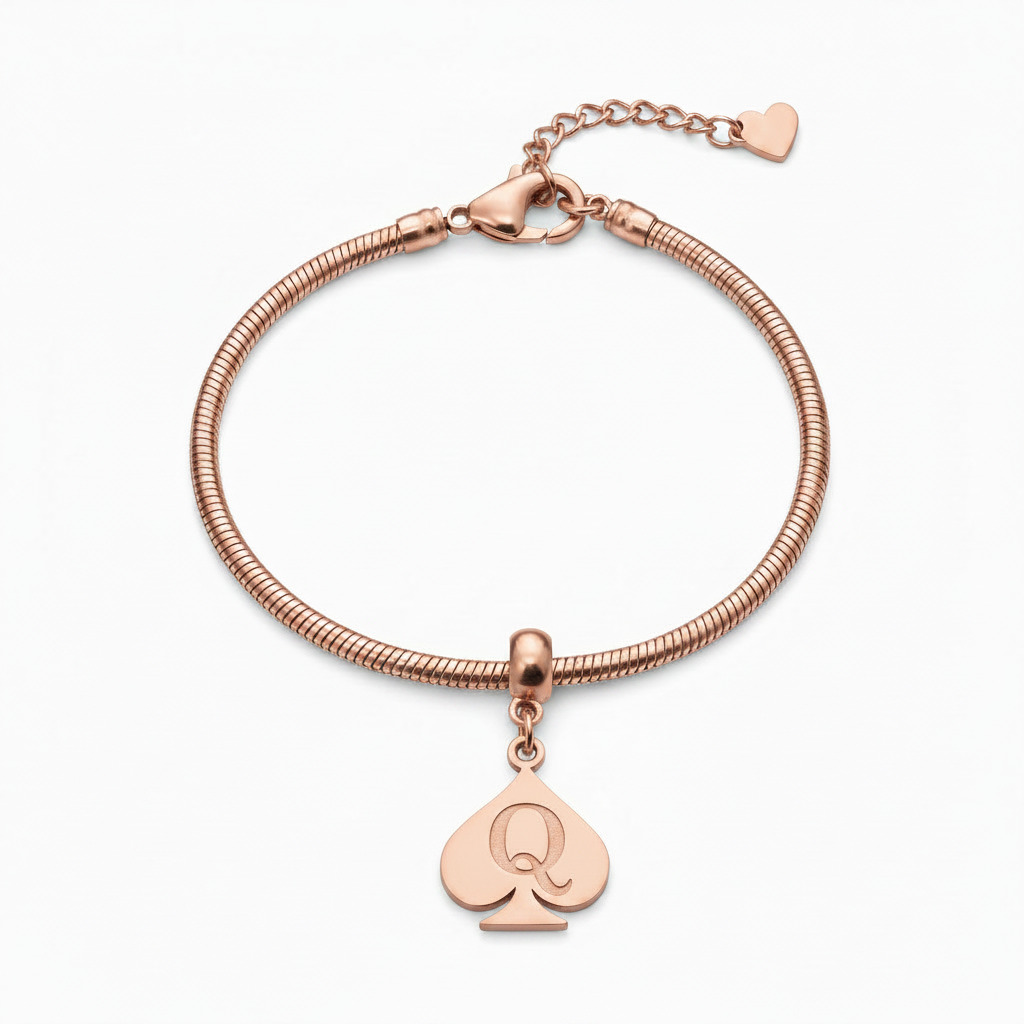 A dark gunmetal gray metal bracelet featuring a coiled snake-style band, a lobster clasp with an extender chain and heart tag, and a dangling spade-shaped charm engraved with the letter 'Q'.