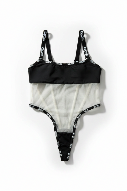 A black and white asymmetrical one-piece swimsuit with a solid black top band, a sheer white mesh midsection, and black straps printed with the white 'OOS' logo, laid flat on a white background.