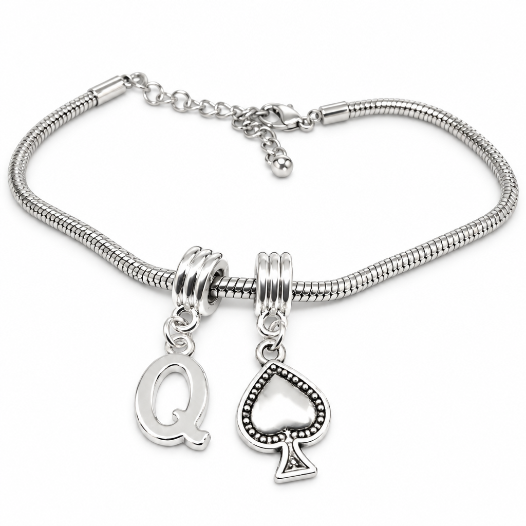 A silver snake chain bracelet with two dangling charms: a capital letter 'Q' and a spade card, shown on a plain white background.