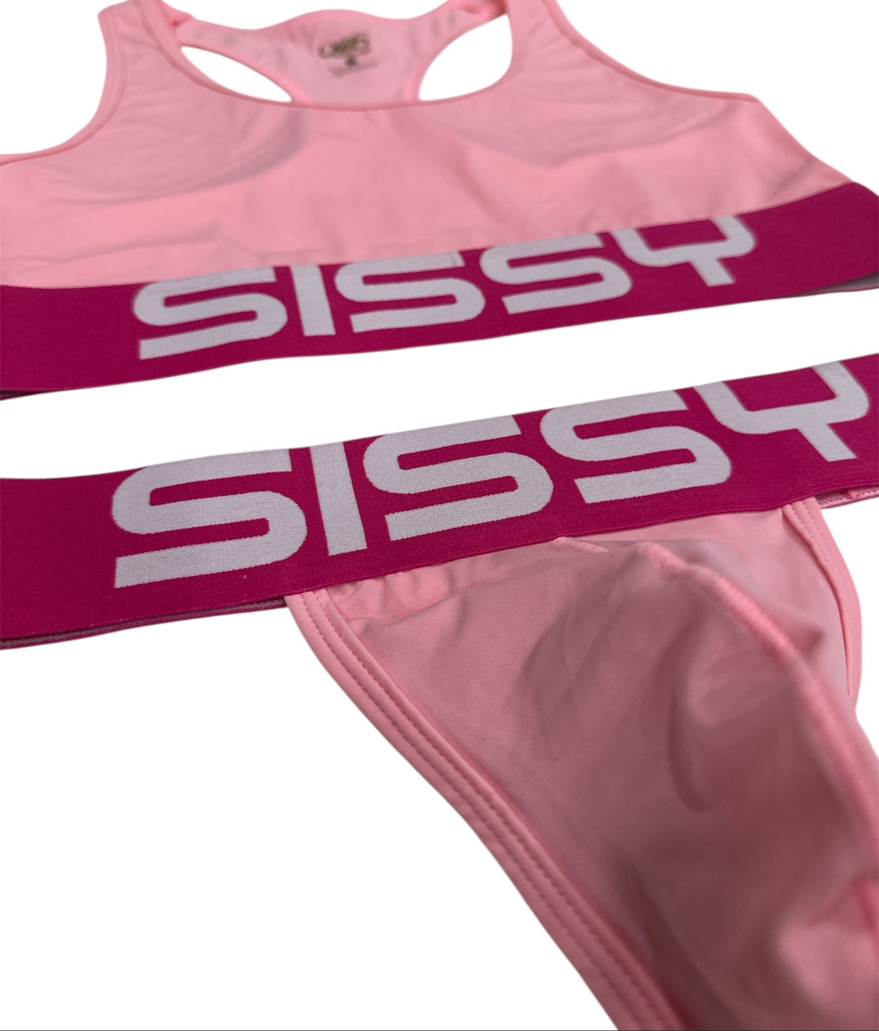 Pink sports bra and shorts with 'SISSY' text on a white background
