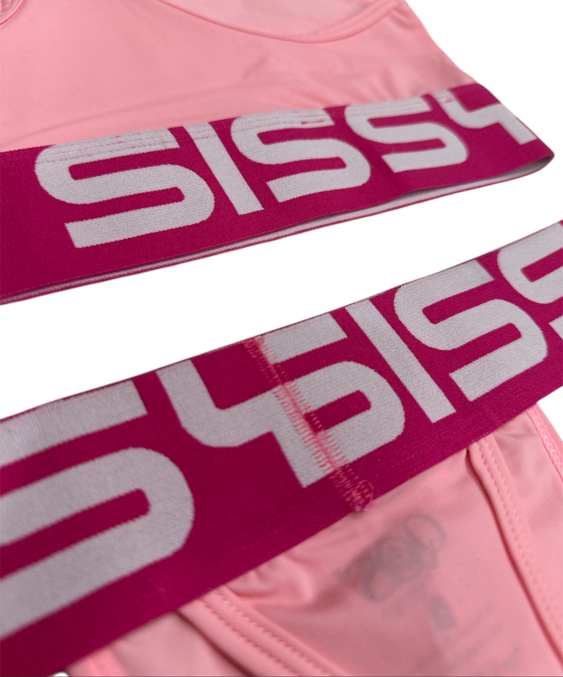 Pink athletic top with 'Sissyo' branding on a white background