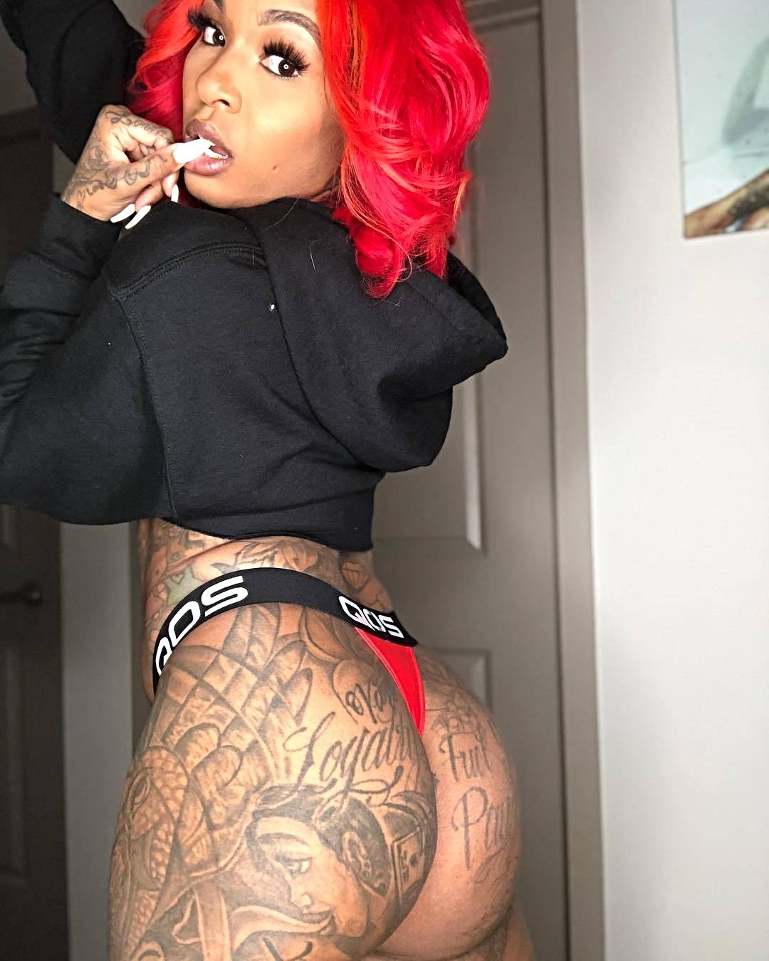 Model @iamtyliyahmonroe with Red QOS Thong 